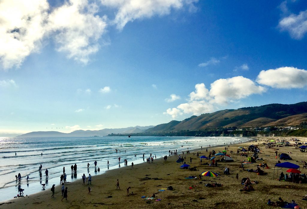 North-facing view of Pismo Beach and many beachgoers